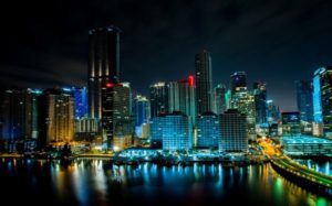 Nighttime view at the waters edge of the city of Miami, FL courtesy of Steele Rutherford