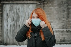 Redhead girl with a mask during the 2020 coronavirus outbreak. Photo courtesy of Pille Riin Priske.
